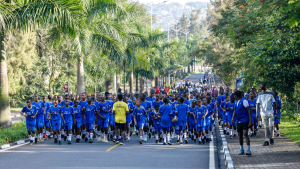 A group of people walking in a during a car free day in Kigali, Rwanda.